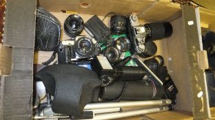 Various camera equipment to include an Olympus COM 30 camera, a Canon 421151 camera,