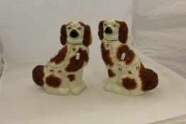 A pair of Victorian Staffordshire Spaniel ornaments