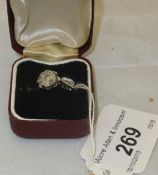 An 18 carat gold diamond cluster ring of flower head form CONDITION REPORTS Size 0/P. Some general