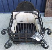 A cast iron fire basket and back