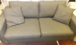 A modern Ulterior Design upholstered sofa