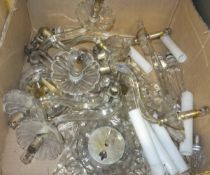 A box containing cut glass ceiling / wall light fittings