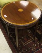 An Edwardian inlaid circular two tier occasional table