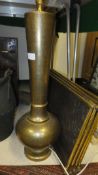 A large Eastern brass table lamp base with all over floral design,