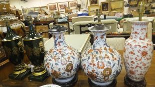 A pair of Oriental style baluster shaped table lamp bases, a further Oriental style table lamp base,