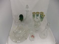 A collection of glassware to include a cut glass wine ewer, a cut glass decanter,
