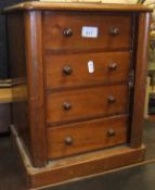 A miniature mahogany Wellington chest of four drawers CONDITION REPORTS Basically sound, although