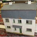 A late 20th Century painted wooden dolls house by Tristram Pinecoffin, with various furniture,