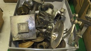 A box containing assorted metal wares to include candle sconces, a circa 1930's travel clock,