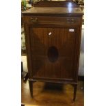An early 20th Century mahogany display cabinet with two glazed doors over two panelled doors and an