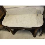 A Victorian mahogany Duchess washstand with grey veined white marble top