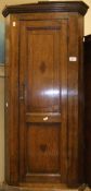 A 19th Century oak corner cupboard with single panelled door