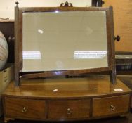 A 19th Century mahogany rectangular dressing table mirror raised on a stand of three drawers