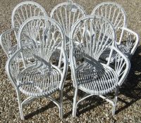 A set of five white painted bamboo framed conservatory chairs