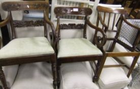 A 19th Century mahogany carver dining chair and two further mahogany framed carver dining chairs