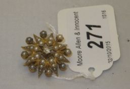 A 15 carat gold pearl and diamond set Victorian starburst brooch