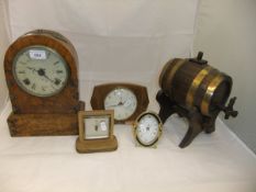 A late 19th Century walnut cased dome topped mantel clock with decorative brass mounts,