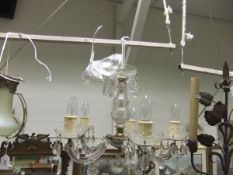 A Venetian style glass five branch electrolier with clear cut glass drops