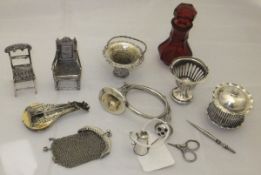 A collection of miniature silver and other items to include two miniature Dutch silver chairs,