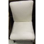 A Victorian upholstered nursing chair on turned front legs