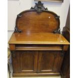 A mahogany chiffonier with single drawer above two cupboard doors on a plinth base