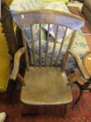 A circa 1900 beech and elm stick back Windsor carver armchair