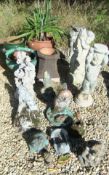 Three composite stone garden statues,
