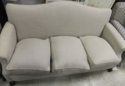 An early 20th Century upholstered scroll arm three seat sofa