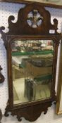 A 19th Century walnut veneered fretwork mirror with gilt Prince of Wales feather decorated surmount