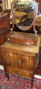 A 19th Century mahogany night table with two cupboard doors above a drawer on square tapered legs,