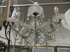 A Venetian style glass electrolier with cut glass swags and clear cut glass drops,