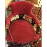 A late Victorian mahogany framed salon chair with upholstered back and seat on cabriole front legs