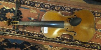 A full size violin with scrolled head stock, ebony effect finger board  CONDITION REPORTS Violin has