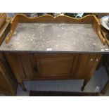 A marble topped mahogany washstand with single drawer and three quarter galleried top