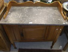 A marble topped mahogany washstand with single drawer and three quarter galleried top