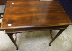 A ladies mahogany writing table with rising top,