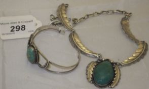 A native American, possibly Navaho, silver and turquoise necklace with leaf decoration,