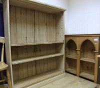 A modern pine two section open bookcase of Gothic arch form,
