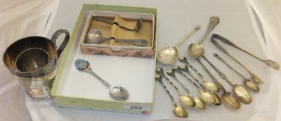 A box containing assorted silver spoons to include a set of six with enamelled floral decoration,