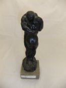 A patinated resin figure depicting "Adam and Eve embracing" AFTER CHARLES SYKES,