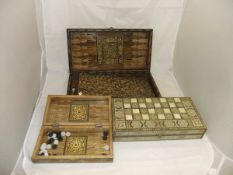 Three modern Eastern inlaid games boxes,