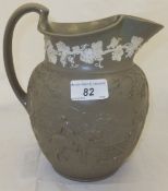 A 19th Century Wedgwood sage green Drab ware jug with relief decoration of huntsman and hounds with