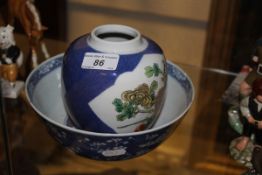 A 19th Century Chinese polychrome decorated ginger jar with panels of flowers and a Chinese blue and