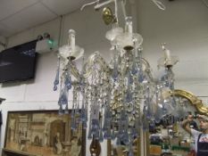 A Venetian style glass chandelier with clear cut glass swags and pale blue glass drops CONDITION