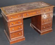 A late 19th Century mahogany kneehole desk by Johnstone , Norman & co,67 New Bond Street ,