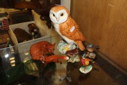 A Beswick owl figure, a Beswick pheasant, a Beswick wren, 993, a Beswick figure of a chaffinch, 991,