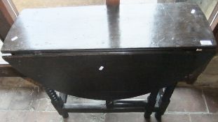 A 19th Century oak oval gate-leg table on bobbin turned legs, united by stretchers CONDITION REPORTS