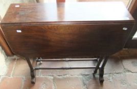 A 19th Century mahogany Sutherland table on ringed and turned supports united by stretchers