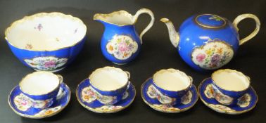 A 19th Century Meissen part tea set, royal blue ground with gilt lining and panels of floral