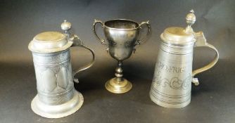 A pewter tankard, the lid marked "IWS", the base of the interior with tooled decoration,